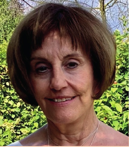 Vrijwilligster Marleen Kosten — foto uit de wijkkrant, pagina 12